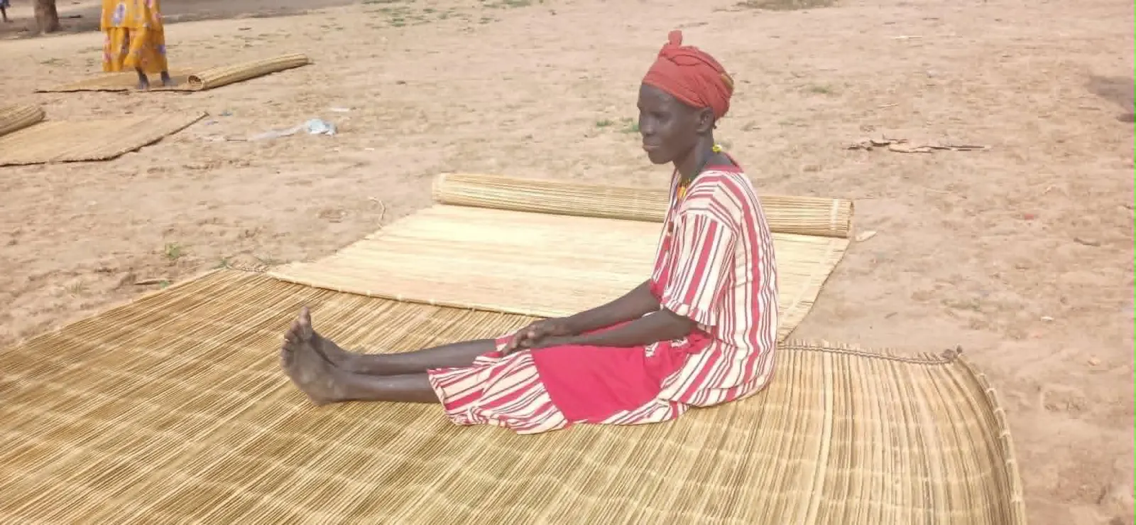 A woman selling locally made mats at Turalei Market in Twic County, Warrap State. (Image Credit: Majok Kuol/Twic Media Reports)
