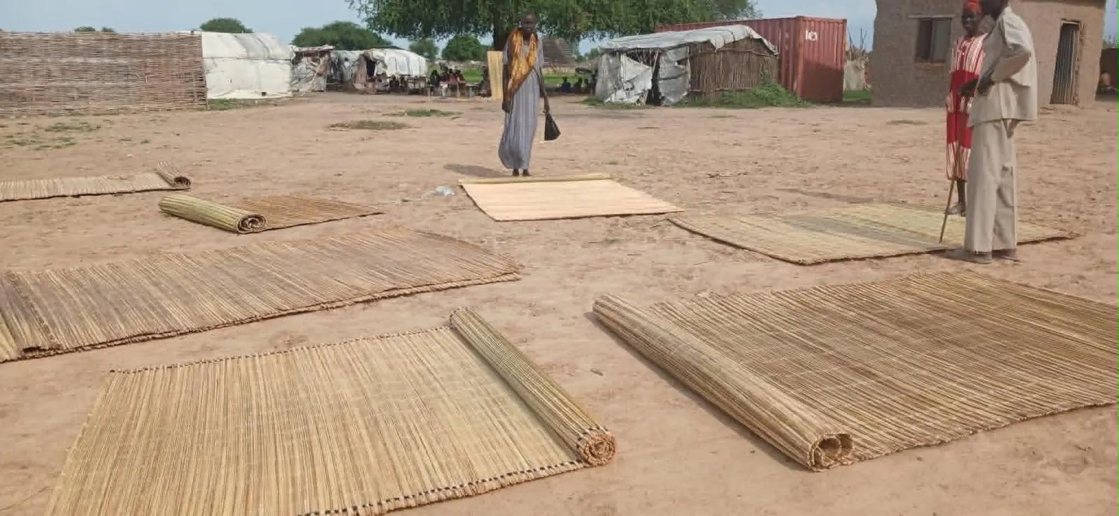 Two women selling firewood at Turalei Market in Twic County, Warrap State. (Image Credit: Majok Kuol/Twic Media Reports)